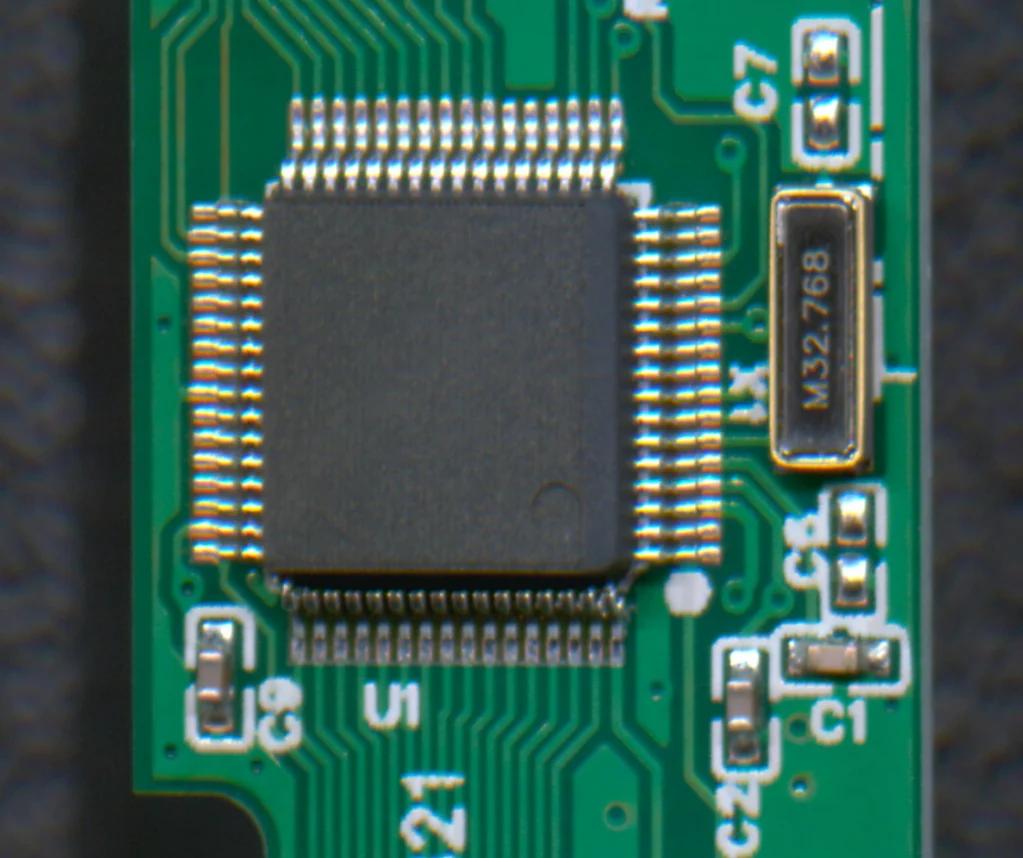 Close-up of a leaded IC and its solder joints